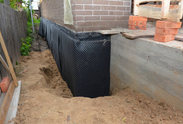 Happy homeowners after waterproofing job in Eden
